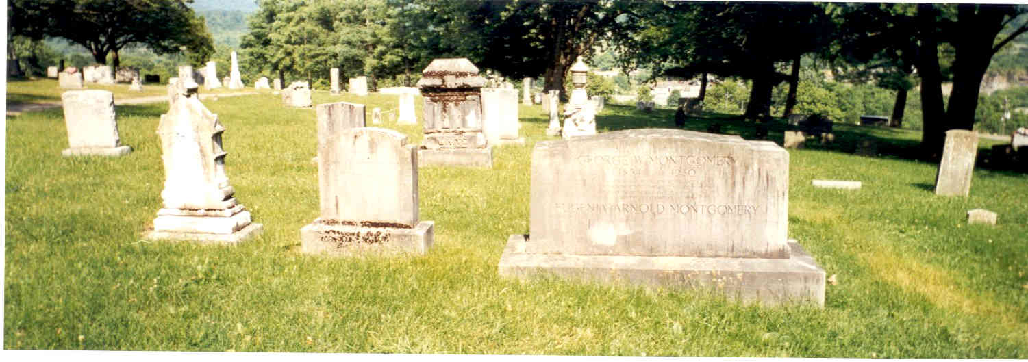 The larger tombstone is Geroge Washington Montgomery, lawyer, born 1854.